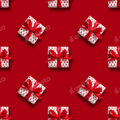 Preview: Christmas gift with red bow on white. Xmas. Happy. New Year. Flat lay style.