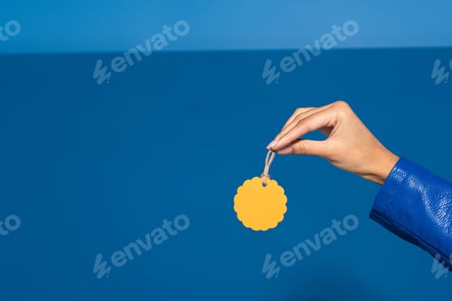 Preview: cropped view of african american woman holding blank label on blue background