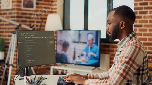 Preview: Software developer programming html code on computer