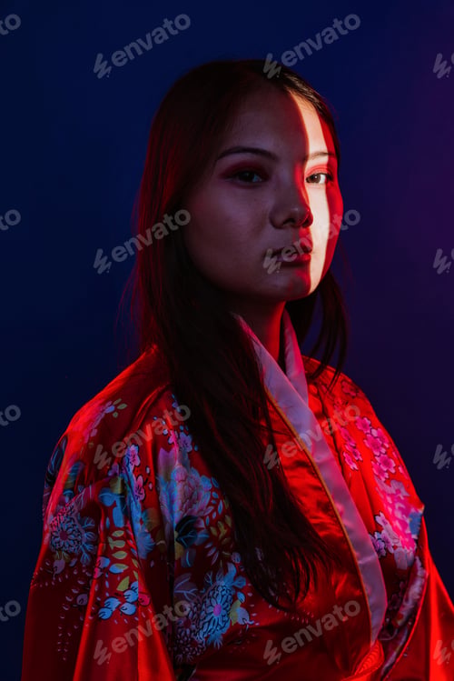 Preview: Asian woman wearing traditional kimono with red light
