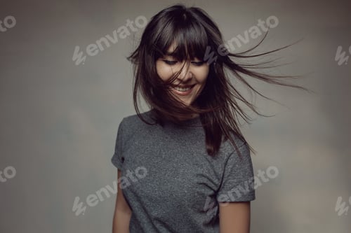 Preview: Pretty brunette woman posing in light room