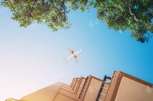 Preview: Airplane Flying Over the Blue Sky.
