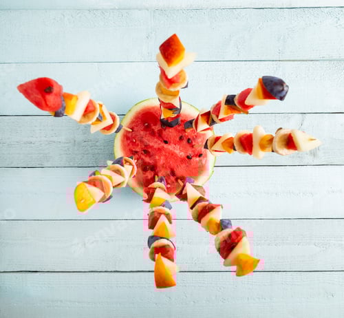 Preview: Colorful Fruit Skewers on a Pale Blue Surface