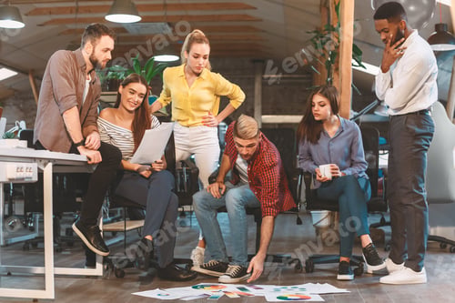 Preview: Team Collaborating on Project in Modern Office Space During Daytime