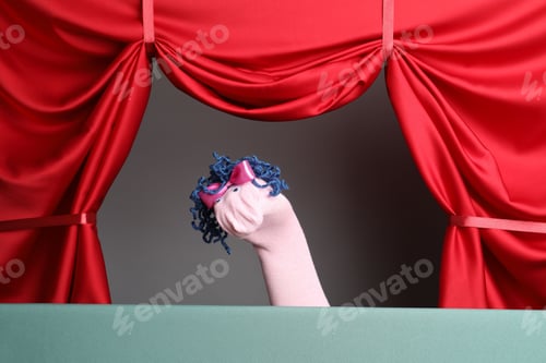 Preview: Creative puppet show on stage with red curtains