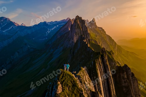 Preview: couple at Schaeffler mountain ridge swiss Alpstein, Appenzell Switzerland,Schaeffler peak