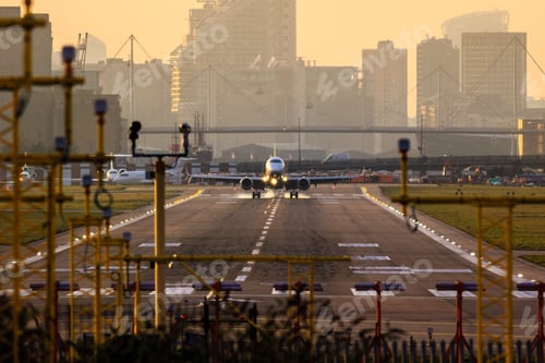 Preview: Large commercial aircraft landing on a spacious airport