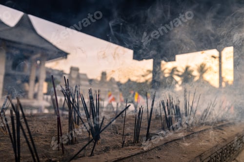 Preview: Incense sticks burning with smoke in ancient Buddhist temple