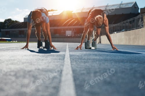 Preview: Sprinters at starting blocks ready for race