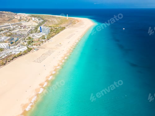 Preview: White sandy beach and blue water in Morro Jable, south of Fuerteventura, Canary islands