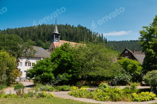 Preview: Spa gardens of Bad Teinach with buildings between the trees in the Black Forest, Germany