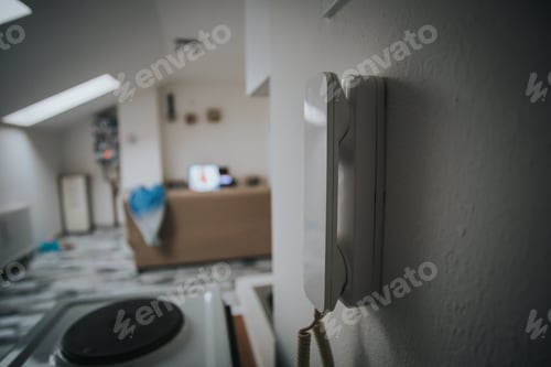 Preview: Closeup of a phone on a wall in a room