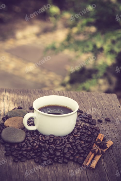 Preview: Coffee cup and coffee bean on a wooden table vintage color