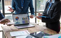 Preview: Business Professionals Analyze Business Data on Laptop