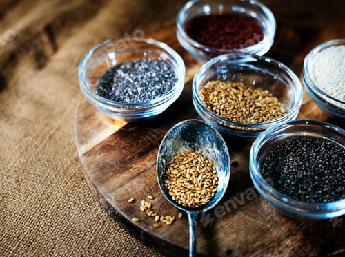 Preview: Aerial of seeds superfood on wooden board and spoon