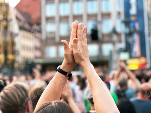 Preview: Hands Applauding in Crowd Unrecognizable People Having Fun During Holiday Music Festival In The City