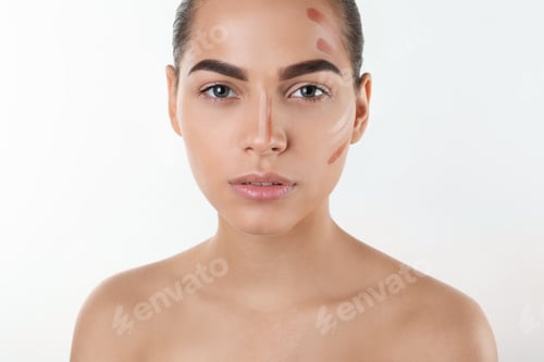 Preview: Portrait of beautiful woman with makeup contouring lines on white background