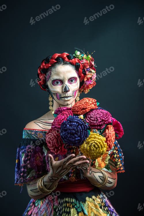 Preview: Latina woman dressed as a Mexican Catrina, with bold skull makeup