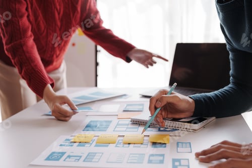 Preview: Designer, programmers, developers of mobile applications work together to invent a modern mobile