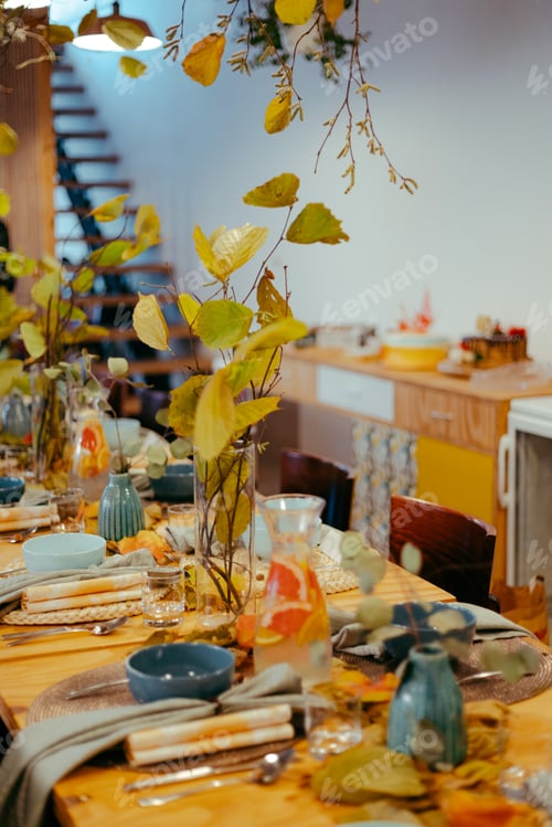 Preview: Vertical shot of a colorful table set and a grapefruit lemonade.