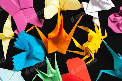 Preview: Colorful origami figures arranged on a black background showcasing various shapes and designs