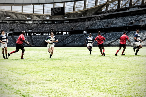 Preview: Digital composite image of team of rugby players playing rugby in sports stadium