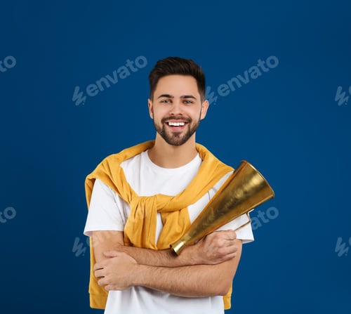 Preview: Young man with megaphone on blue background
