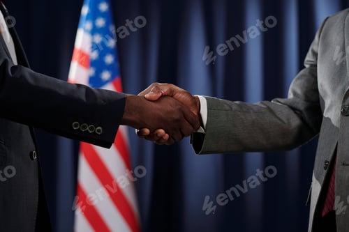 Preview: Two African American male delegates or political leaders shaking hands