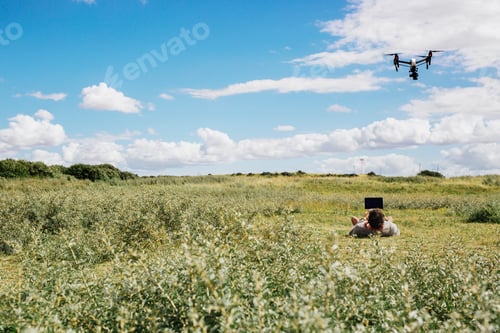 Preview: Man flying drone using remote control