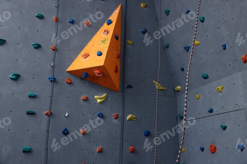 Preview: Climbing wall with holds in gym. Extreme sport