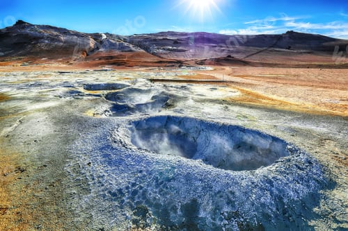 Preview: Boiling mudpots in the geothermal area Hverir and cracked ground around.