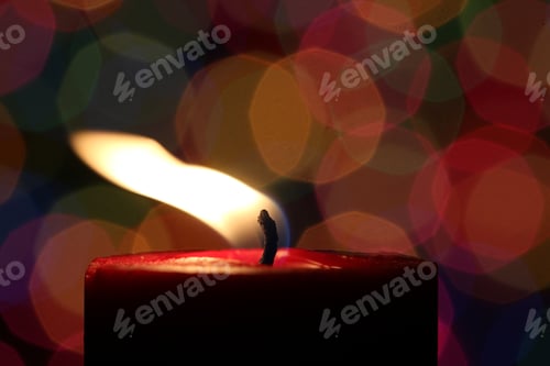Preview: Burning Candle With Multi Colored Light Background - Photograph Of A Lit Candle With Multi Colored