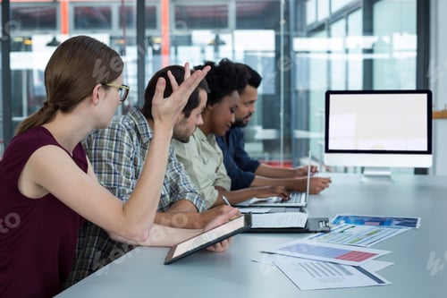 Preview: Business executives discussing in a meeting