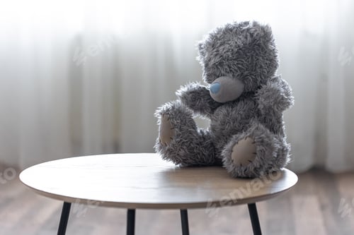 Preview: Teddy bear on a blurred background in the room.
