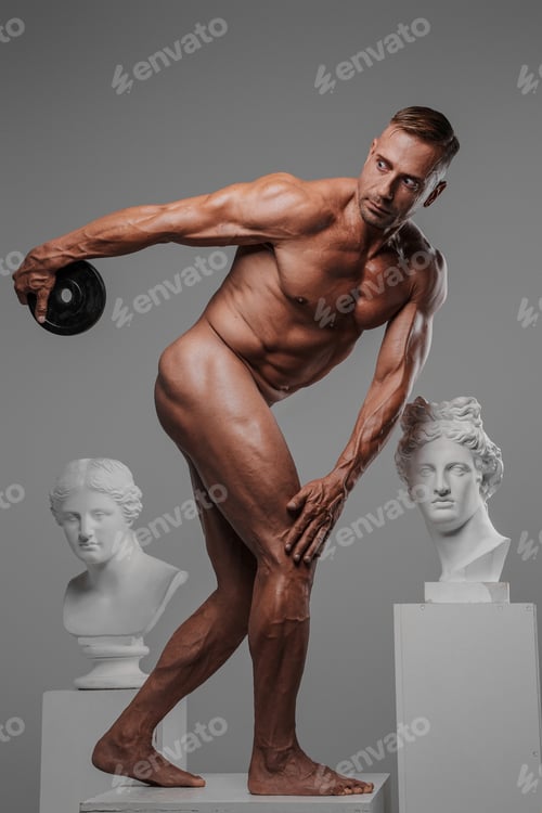 Preview: A muscular and attractive naked male model holding a weight plate