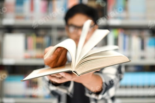 Preview: Close-up of hand flipping the book