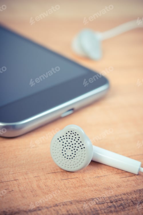 Preview: Vintage photo, Mobile phone, smartphone with headphones