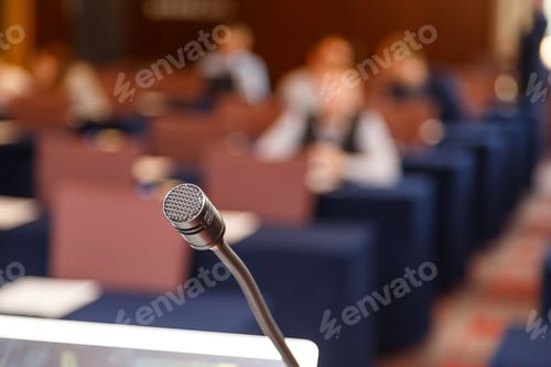 Preview: Microphone over conference hall background
