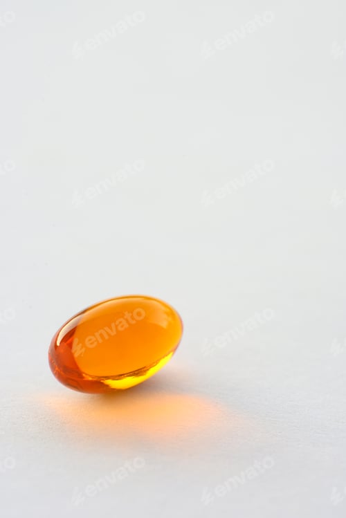 Preview: Detail of orange pills in packaging and isolated