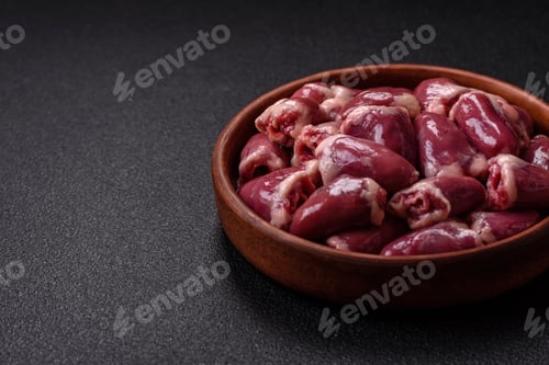 Preview: Raw chicken hearts with salt, spices and herbs