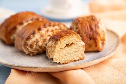 Preview: Traditional armenian dessert gata with cup of coffee on a blue wooden background