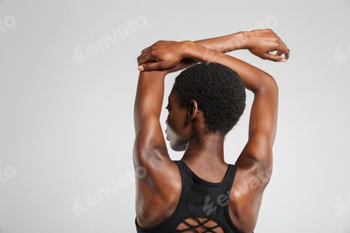 Preview: Image from back african american woman stretching her arms
