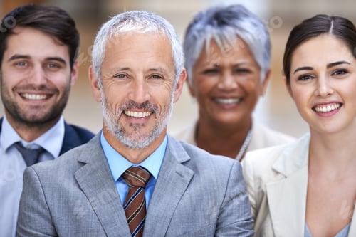 Preview: We stand by our word. Shot of a group of confident businesspeople.