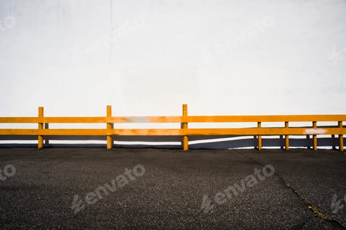 Preview: Wooden railing over asphalt.