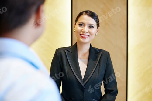 Preview: Hotel manager greeting guest at reception