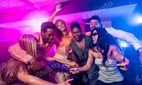Preview: Friends dancing together and having fun at nightclub party