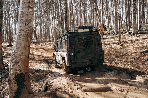 Preview: Offroad car driving through the forest road of mud