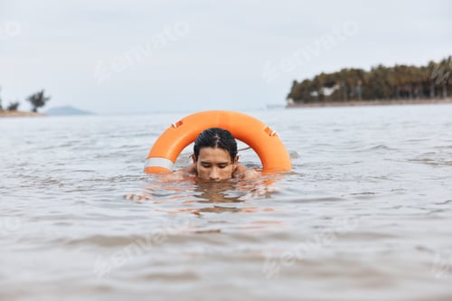 Preview: Swim, Save, Protect: A Vigilant Lifeguard on the Beach, Ensuring Safety and Joy amidst the Blue