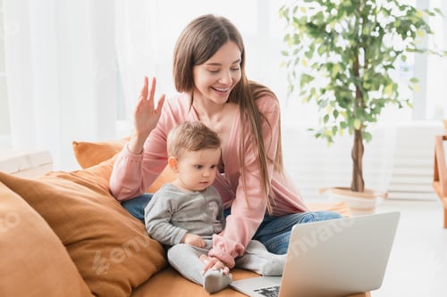 Preview: Happy young mother with toddler infant newborn baby having video call online conference