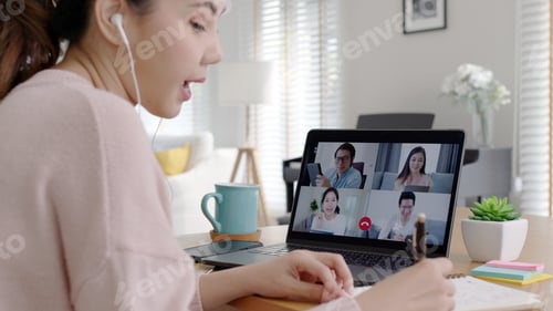 Preview: Back view of business woman talking about sale report in video conference